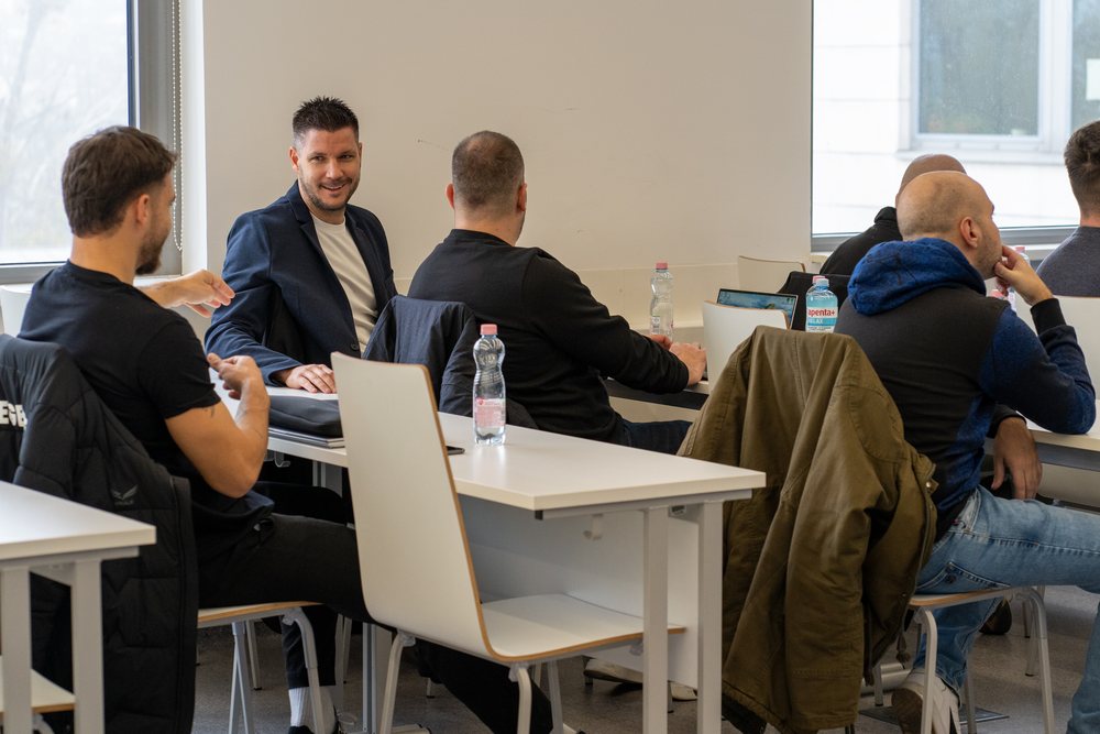 A lecturer talking with participants